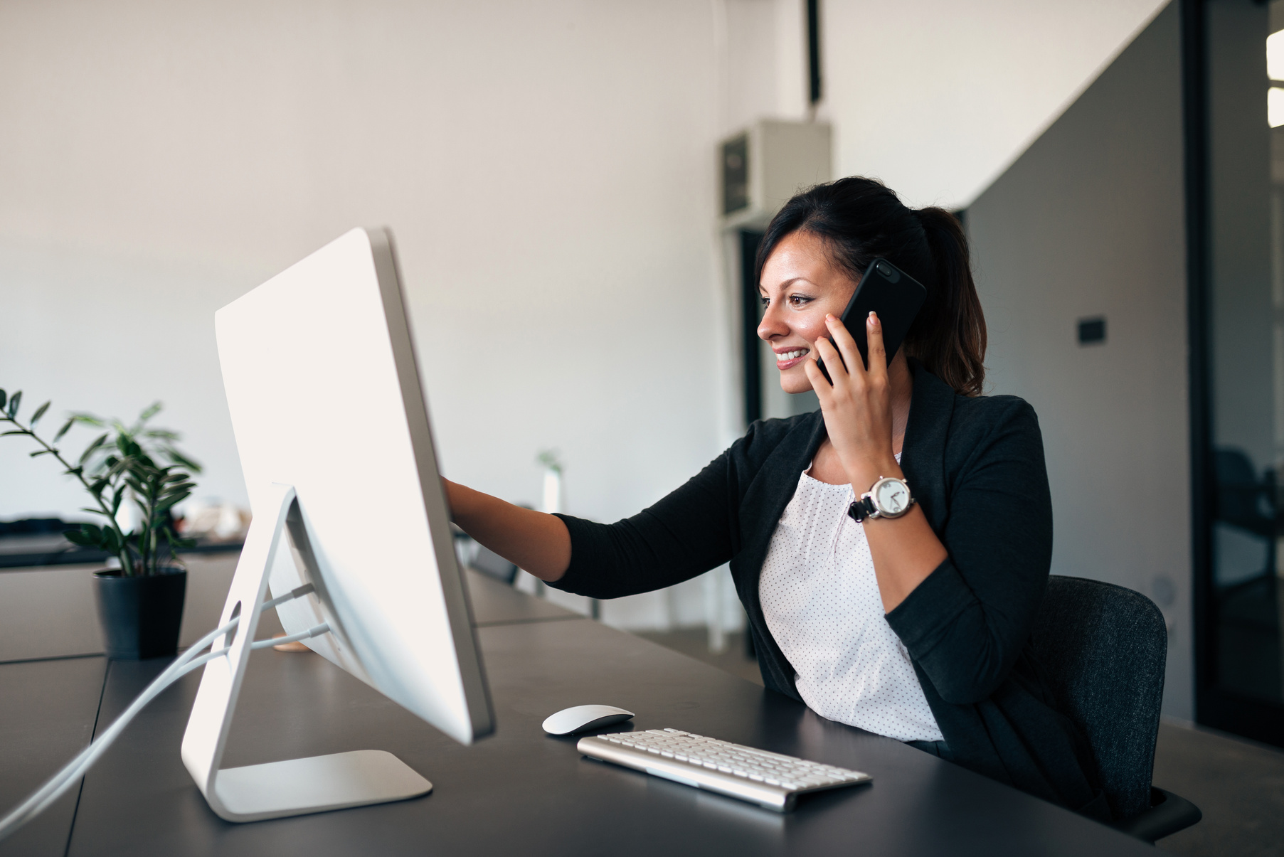 Female administrator working on a computer.